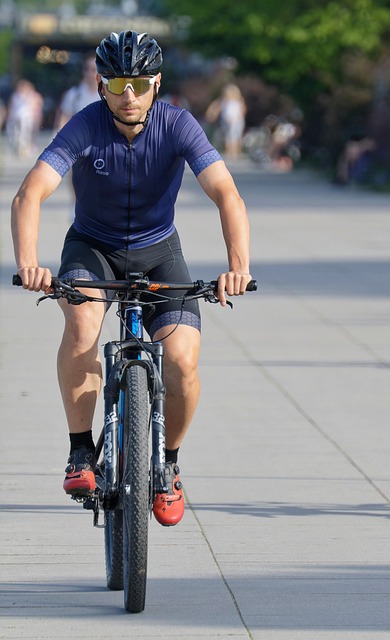 beginner cyclist adjusting helmet and checking bike in Dublin park