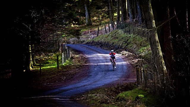 cyclist preparing bike outdoors Ireland green hills maintenance check